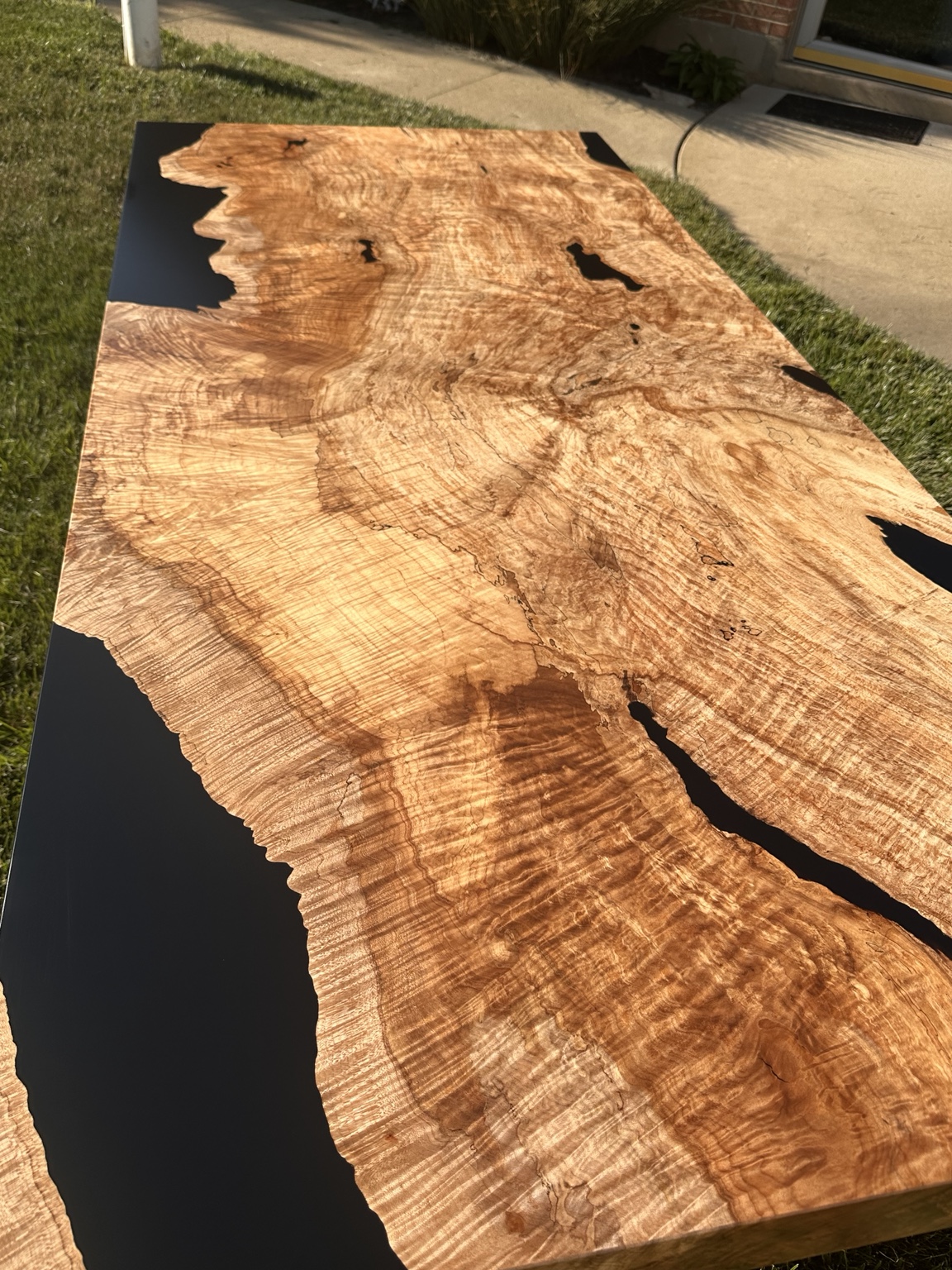 Golden figured maple burl tabletop with black resin