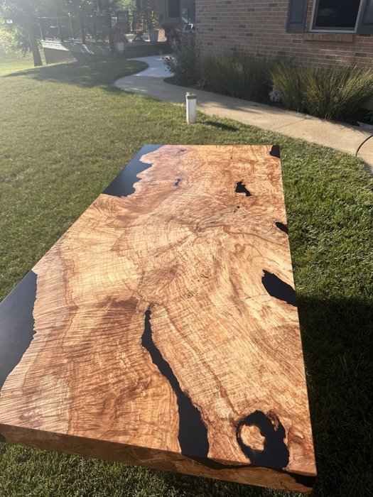 Maple burl tabletop viewed along its length