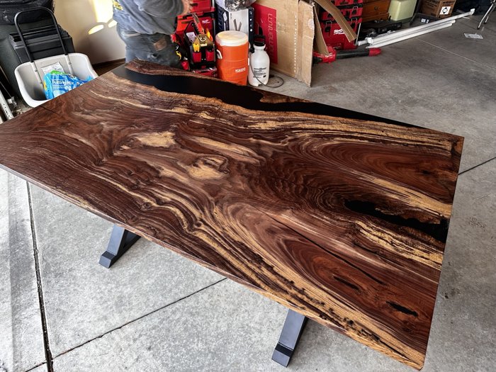 Angled view of the second Clara walnut dining table