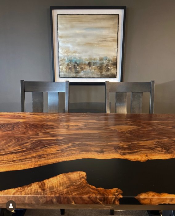 Walnut dining table displayed with chairs