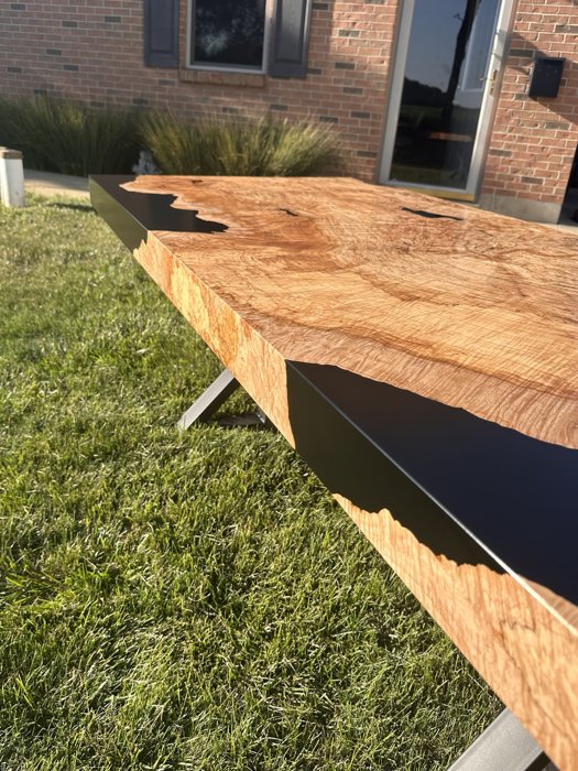 Side view of the finished tabletop and black resin edge